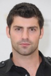 Slika glumca Travis Milne